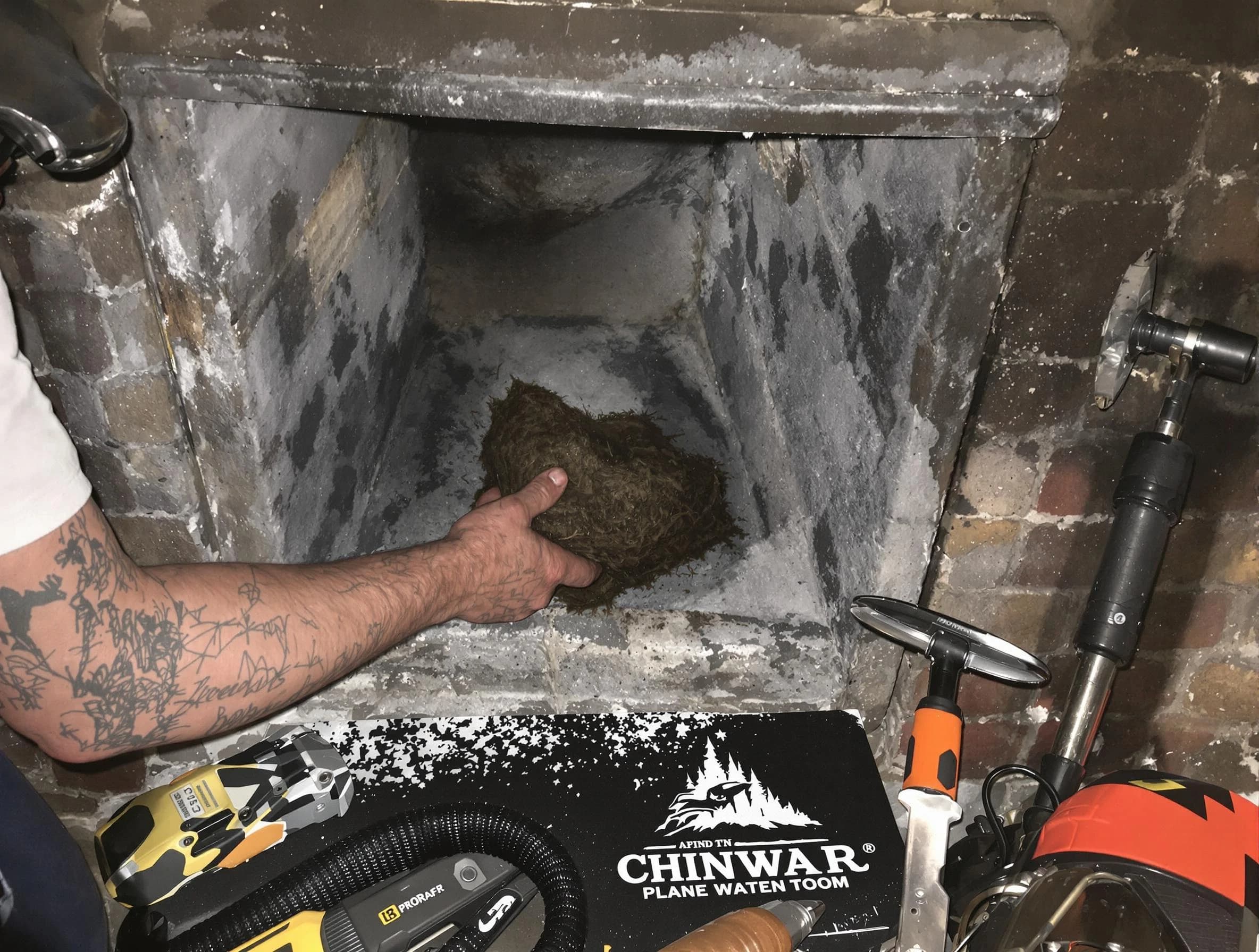 Heron Bay Chimney Sweep safely removing debris and screening chimney in Heron Bay, GA